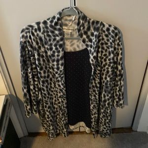 3X woman’s. Fun cardigan with tank shell attached . It is very dark navy.